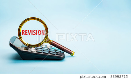 Magnifying glass with the word REVISION. Word writing text Revis 88998715