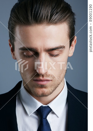 Hes got style. Cropped shot of a handsome and fashionable young man posing in the studio. 89001190