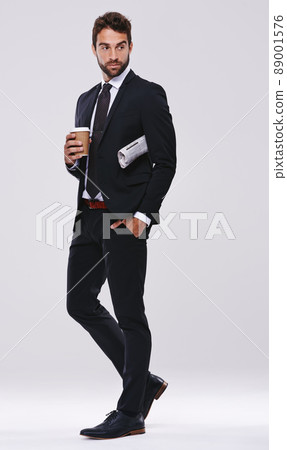 The morning commute. Studio shot of a handsome and well-dressed young man. The morning commute. Studio shot of a handsome and well-dressed young man. 89001576