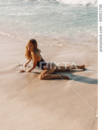 Sensual young woman, sexy model in bikini at tropical beach 89001706
