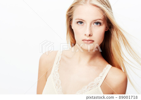 Her gaze is magnetic. A stunning young blond isolated on a white background. Her gaze is magnetic. A stunning young blond isolated on a white background. 89001718