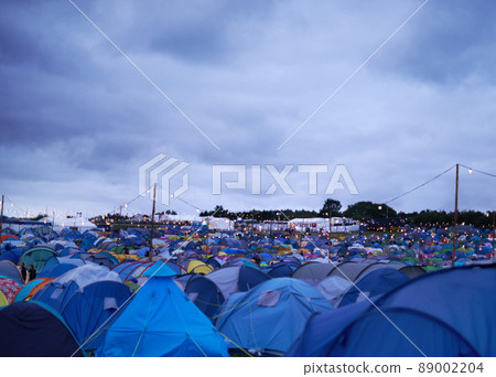 This festival is going to be intents. Cropped shot of various tents set up at an outdoor festival. 89002204