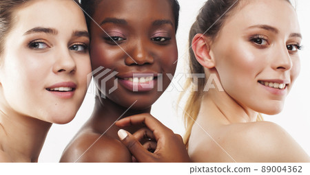 three different nation woman: african-american, caucasian together isolated on white background happy smiling, diverse type on skin, lifestyle real people concept three different nation woman: african-american, caucasian together isolated on white background happy smiling, diverse type on skin, lifestyle real people concept 89004362