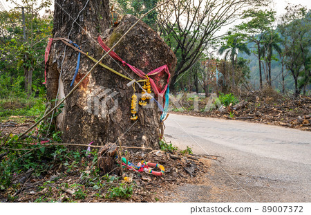 Flowers and garland are offerings to the Thai tree spirit. Thai peoples belief the spirit can help you win the lottery, heal, help with a pregnancy or lead you to your death. Flowers and garland are offerings to the Thai tree spirit. Thai peoples belief the spirit can help you win the lottery, heal, help with a pregnancy or lead you to your death. 89007372