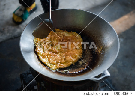 Thai style omelet in Thai street food restaurant 89008669