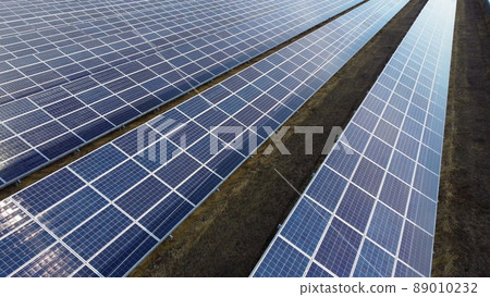 Aerial drone view solar panels on sunny day close-up. Photovoltaic solar panel Aerial drone view solar panels on sunny day close-up. Photovoltaic solar panel 89010232