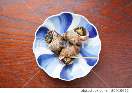 Boiled baigai served on a small plate 89010652