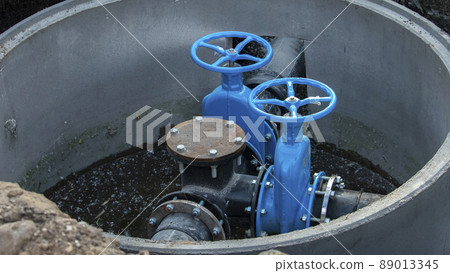 two blue valves for water supply in the new sewer well 89013345