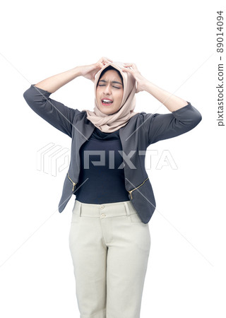 Asian Muslim woman in a headscarf feeling headache 89014094