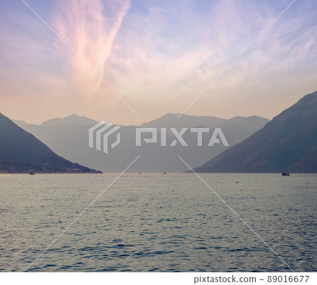 Sunset, beautiful landscape with silhouettes of trees. Travel concept. Montenegro, Kotor Bay. Sunset at Kotor Bay Montenegro. View of the sunset in Boko-Kotor Bay in Montenegro. Silhouettes of Sunset, beautiful landscape with silhouettes of trees. Travel concept. Montenegro, Kotor Bay. Sunset at Kotor Bay Montenegro. View of the sunset in Boko-Kotor Bay in Montenegro. Silhouettes of 89016677
