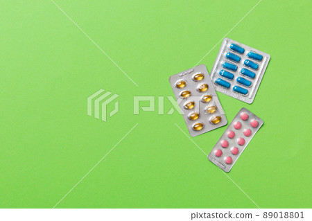 Protective face masks or surgical masks, medicine pills and thermometer on table background. Coronavirus disease. Corona virus concept. Space for text 89018801