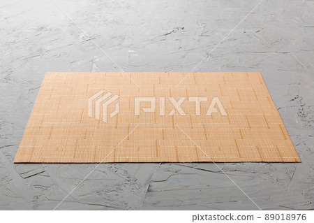 Perspective view of brown tablecloth for food on cement background. Empty space for your design 89018976