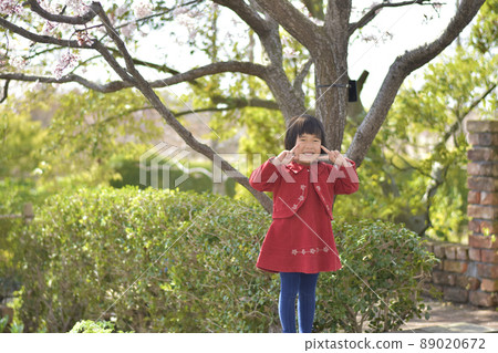 A girl doing a peace sign A girl doing a peace sign 89020672