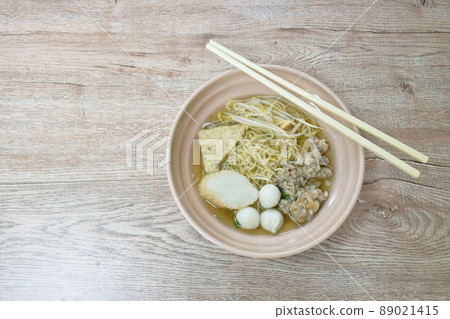 egg yellow noodles topping chop boiled pork and fish ball in soup on bowl egg yellow noodles topping chop boiled pork and fish ball in soup on bowl 89021415