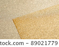 Overlapping gold glitter paper 89021779