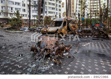Irpin, Kyev region  Ukraine - 09.04.2022: Cities of Ukraine after the Russian occupation. Cars burned down on the street. Irpin, Bucha, Gostomel. 89021966