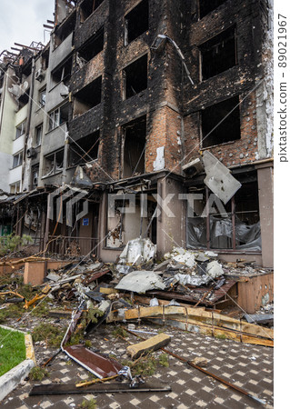 Irpin, Kyev region Ukraine - 09.04.2022: Cities of Ukraine after the Russian occupation. Destroyed buildings on the streets of Irpen. Broken, shelled windows. Buildings after being hit by missiles. Irpin, Kyev region Ukraine - 09.04.2022: Cities of Ukraine after the Russian occupation. Destroyed buildings on the streets of Irpen. Broken, shelled windows. Buildings after being hit by missiles. 89021967