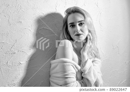 woman in bathrobe 89022647