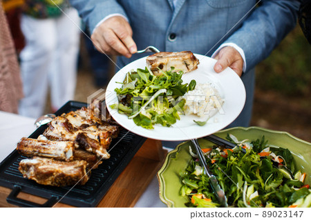 Street food at the wedding or another catered event dinner. 89023147