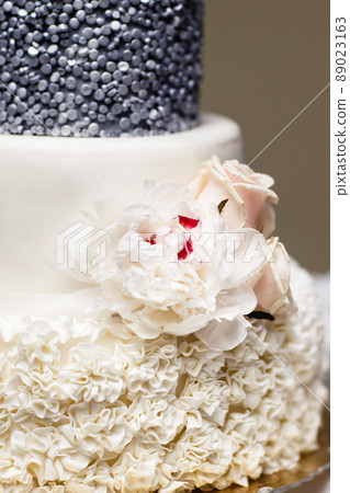 Multi level wedding cake with pink flowers. Multi level wedding cake with pink flowers. 89023163