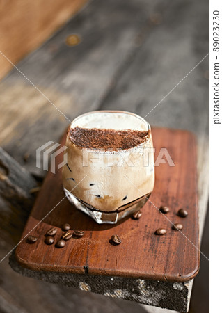 Iced coffee vanilla latte with milk foam. Iced coffee vanilla latte with milk foam. 89023230