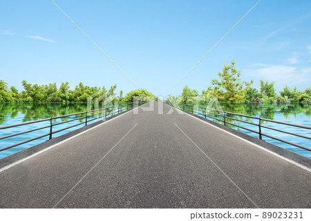Asphalt road with lake Asphalt road with lake 89023231