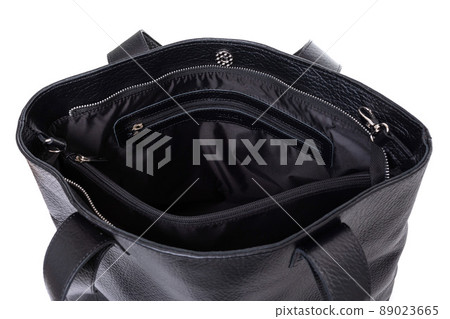 the inside of a women's stylish leather bag with several compartments and hidden pockets 89023665