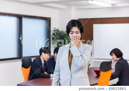 Business woman attending a meeting Business woman attending a meeting 89023863
