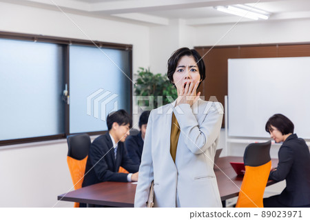 Business woman attending a meeting Business woman attending a meeting 89023971
