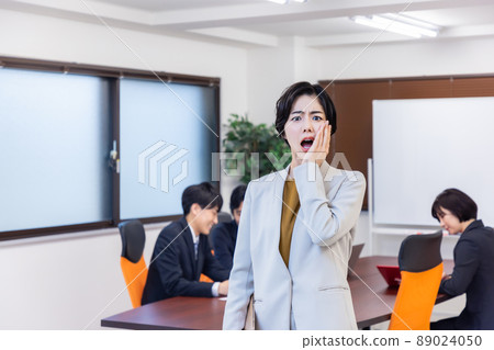 Business woman attending a meeting Business woman attending a meeting 89024050