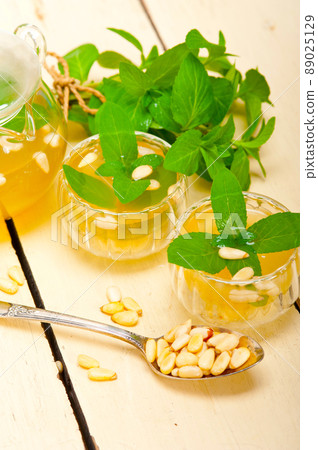 Arab traditional mint and pine nuts tea Arab traditional mint and pine nuts tea 89025129