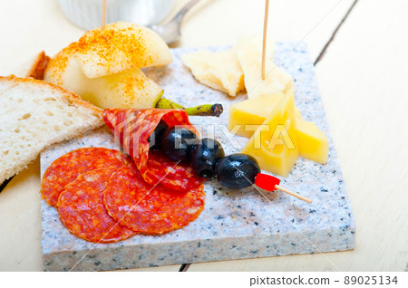 mix cold cut on a stone with fresh pears mix cold cut on a stone with fresh pears 89025134