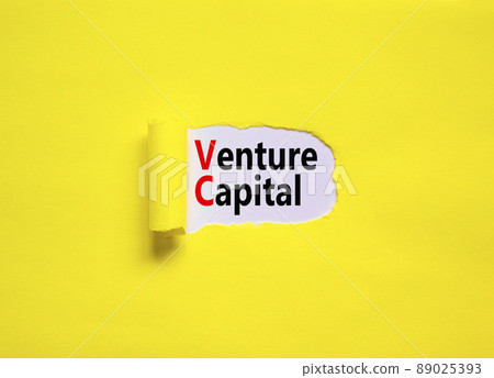 VC venture capital abbraviation symbol. Concept words VC venture capital on yellow paper on a beautiful yellow table white background, copy space. Business and VC venture capital concept. 89025393