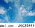 Blue Sky with Some Fluffy Clouds 89025663