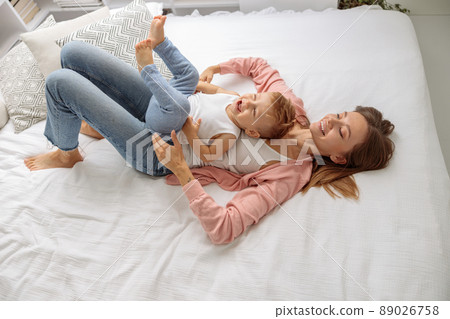 Happy family joyful together in the house Happy family joyful together in the house 89026758