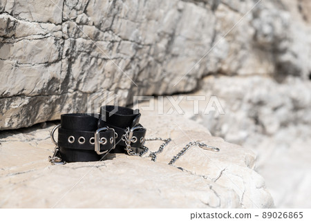 leather handcuffs for bdsm sex toys with a... - Stock Photo [89026865] -  PIXTA