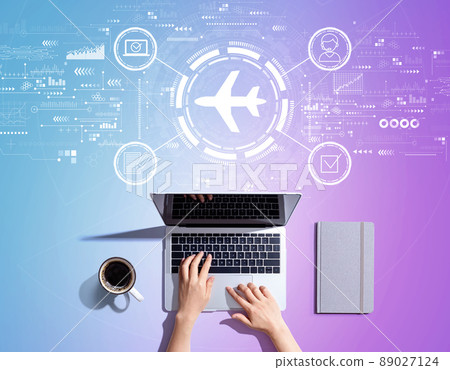 Flight ticket booking concept with person using a laptop Flight ticket booking concept with person using a laptop 89027124
