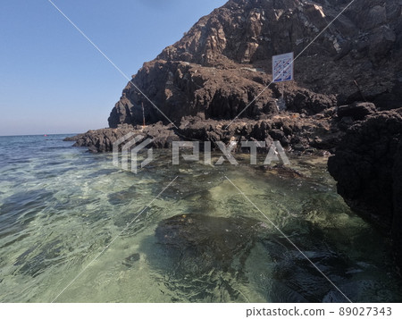 Incredible view from island to beach, small sandy beach on the island, coral reef, fujairah. High quality photo Incredible view from island to beach, small sandy beach on the island, coral reef, fujairah. High quality photo 89027343