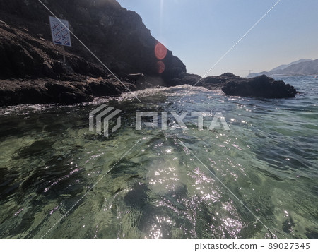 Incredible view from island to beach, small sandy beach on the island, coral reef, fujairah. High quality photo 89027345