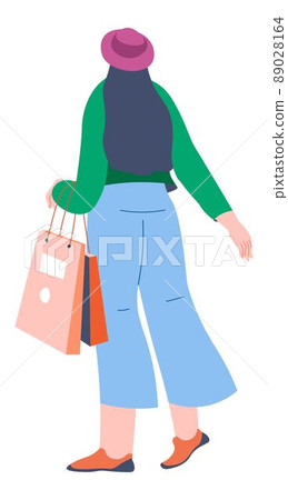 Woman with bags returning from shopping malls 89028164