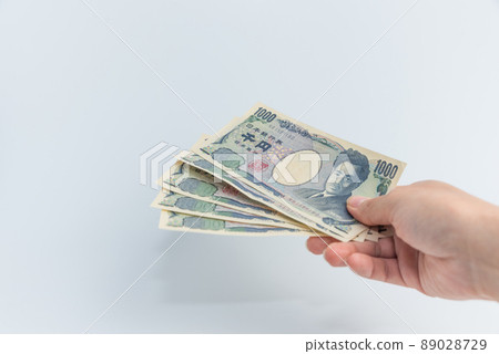 The person who hands the 1000-yen bill, right hand The person who hands the 1000-yen bill, right hand 89028729
