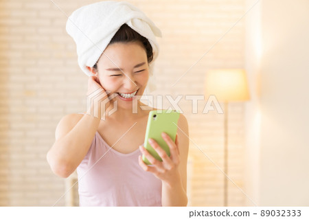 Female smartphone after taking a bath 89032333