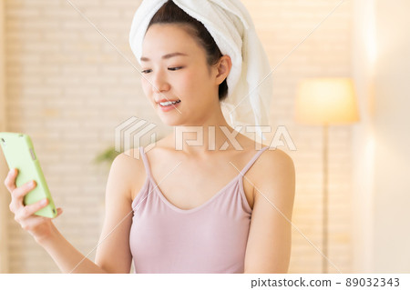 Female smartphone after taking a bath Female smartphone after taking a bath 89032343