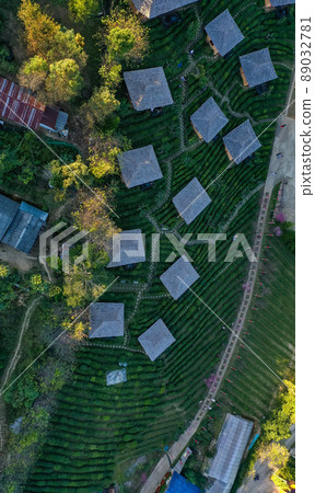 Aerial view of Sunrise with fog over Ban Rak thai, chinese village near a lake in Mae Hong Son Aerial view of Sunrise with fog over Ban Rak thai, chinese village near a lake in Mae Hong Son 89032781