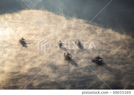 Sunrise with fog over Ban Rak thai, chinese village near a lake in Mae Hong Son, Thailand Sunrise with fog over Ban Rak thai, chinese village near a lake in Mae Hong Son, Thailand 89033169