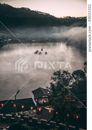 Sunrise with fog over Ban Rak thai, chinese village near a lake in Mae Hong Son, Thailand Sunrise with fog over Ban Rak thai, chinese village near a lake in Mae Hong Son, Thailand 89033302