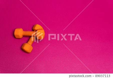 Space mat dumbbell orange fitness gym background purple white, concept healthy lifestyle healthy workout in exercise and texture equipment, weight object. Health activity aerobics, Space mat dumbbell orange fitness gym background purple white, concept healthy lifestyle healthy workout in exercise and texture equipment, weight object. Health activity aerobics, 89037113