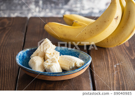 Fresh yellow banana peeled for eating. Fresh yellow banana peeled for eating. 89040985