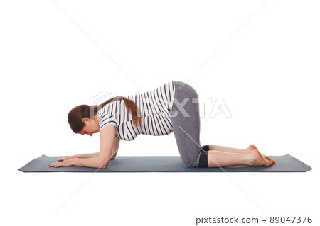 Pregnant woman doing yoga asana Balasana child pose Pregnant woman doing yoga asana Balasana child pose 89047376