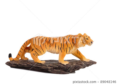 A tiger figurine made of plastic. 89048146